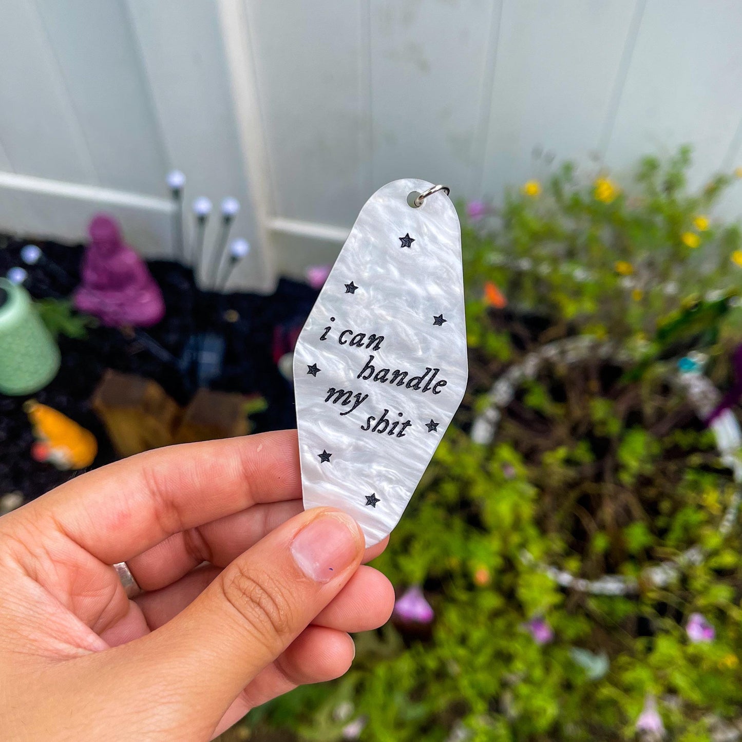 Aesthetic marble motel keychain engraved with the lyrics "I can handle my shit" inspired by Taylor Swift's song I Can Do It With a Broken Heart"