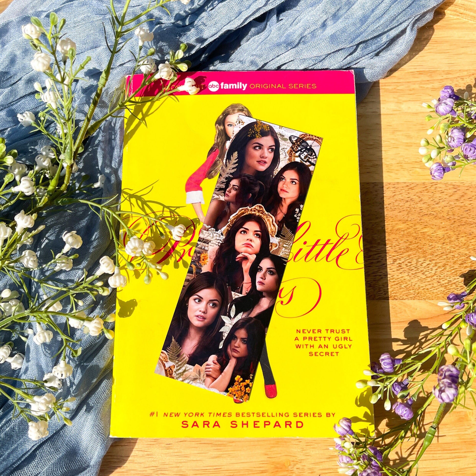 A Pretty Little Liars inspired PLL bookmark with a collage of the character Aria Montgomery.