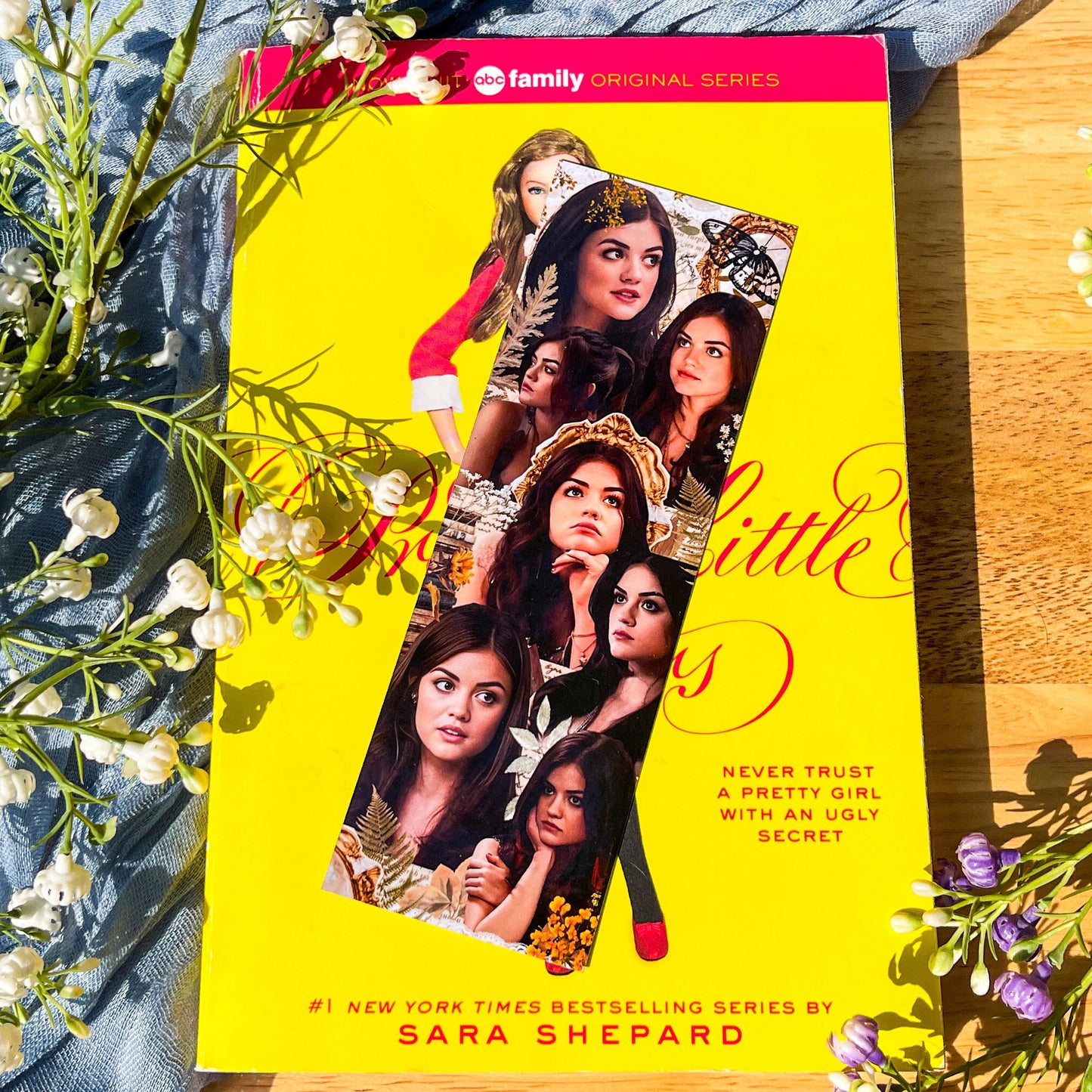 A Pretty Little Liars inspired PLL bookmark with a collage of the character Aria Montgomery.