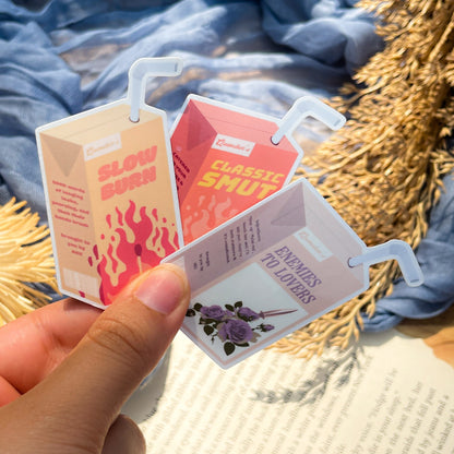 Three different juice box stickers inspired by various book tropes like enemies to lovers, slow burn, and classic smut.