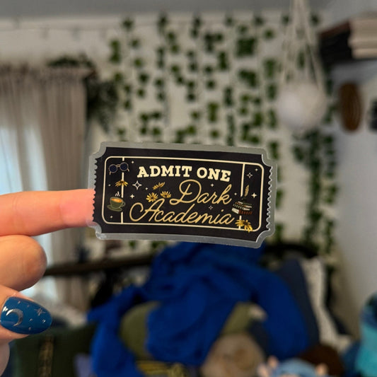  A transparent bookish sticker in shape of an admission ticket with the words "admit one dark academia" for a booktok book club.