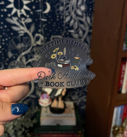 Transparent sticker with the words "lifetime member of the dark academia book club" and illustrations of flowers, books and coffee. 