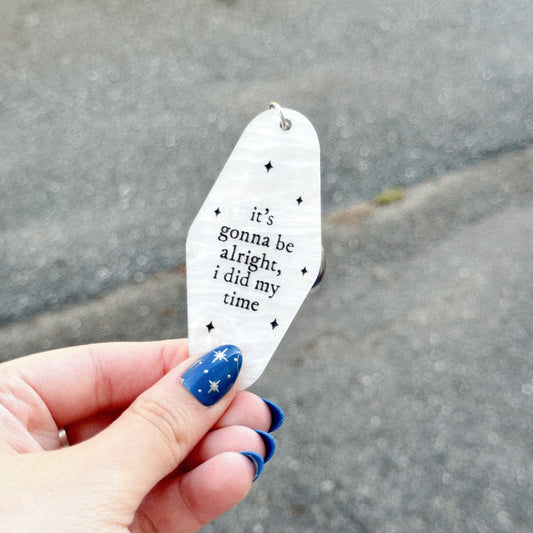 Acrylic motel keychain with the lyrics "it's gonna be alright i did my time " inspired by taylor swift's song fresh out the slammer