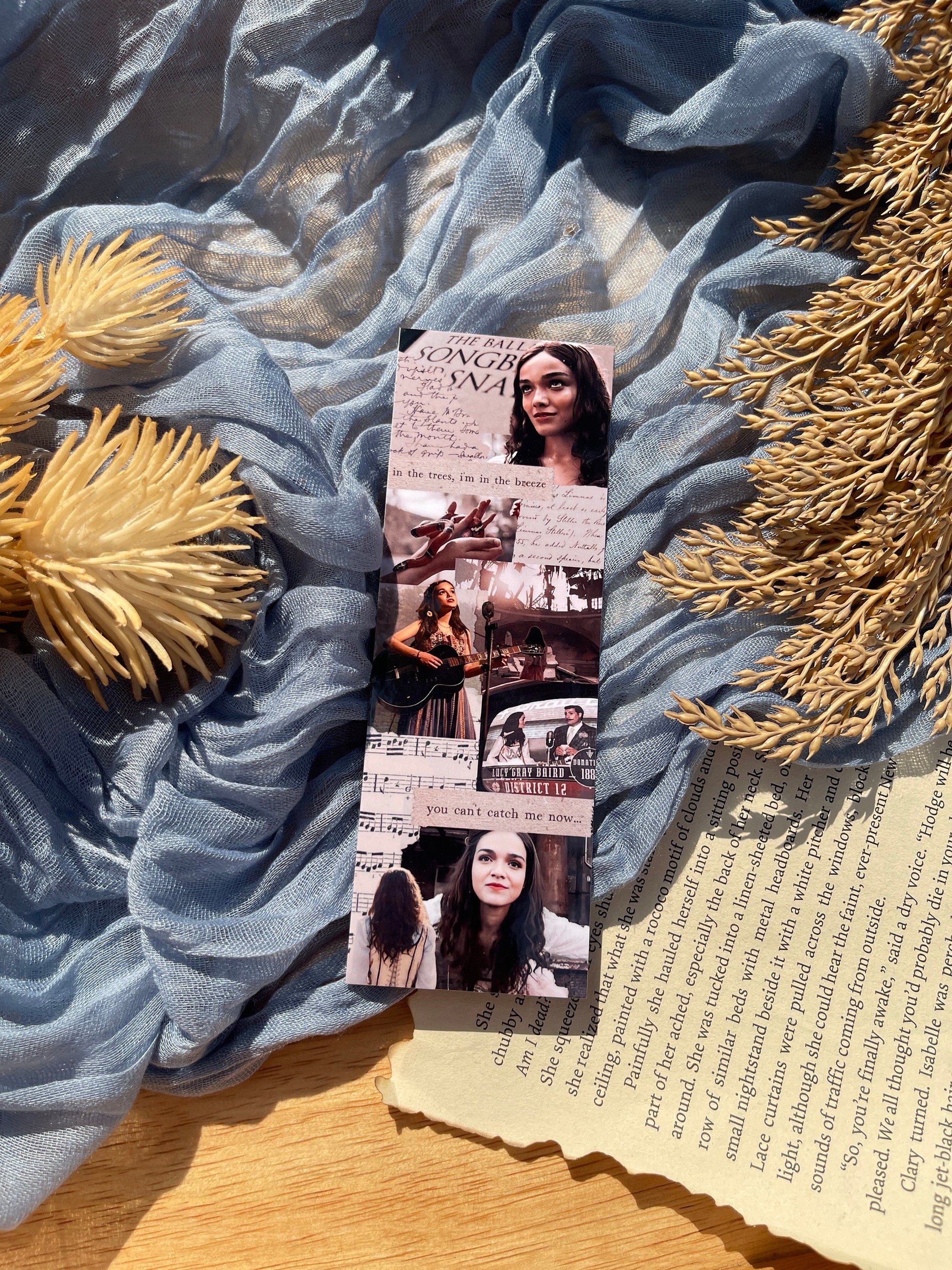 A rectangular collage bookmark inspired by the Hunger Games, Lucy Gray Baird, and the Ballad of Songbirds and Snakes.