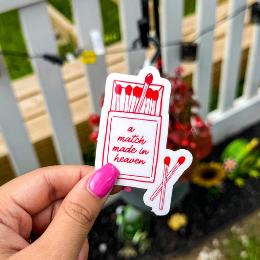 a romance book inspired sticker with a white background with a read outlined matchbox with the quote "match made in heaven"