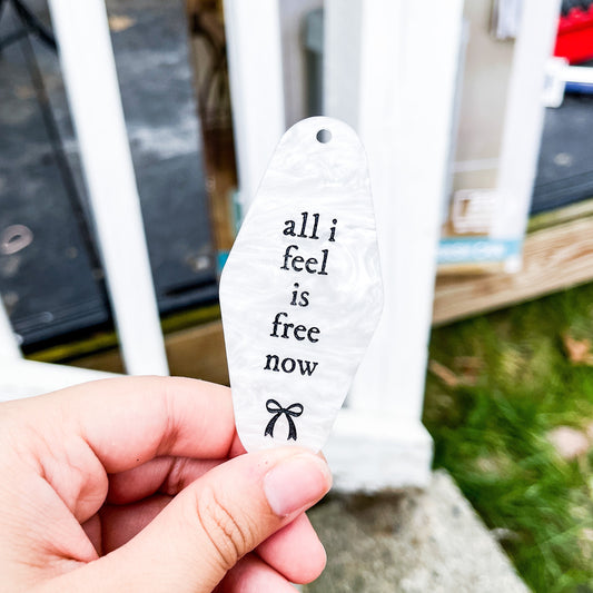 white marble acrylic gracie abrams motel keychain with the lyrics all i feel is free now